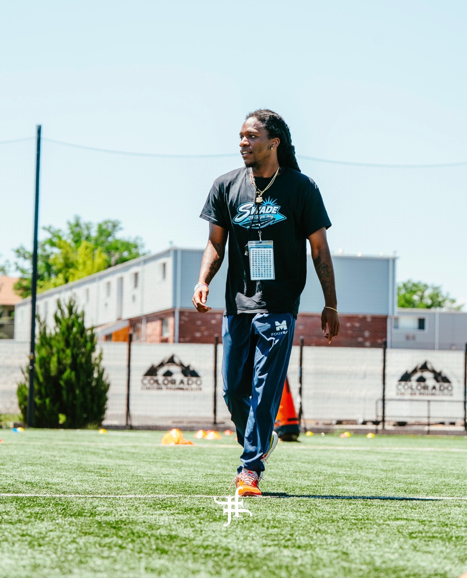 Chau walking the field in SWADE gear